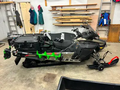 One old owner. Only 279 miles in perfect condition. 900 ACE motor. Comes with ice auger holder. Aux...