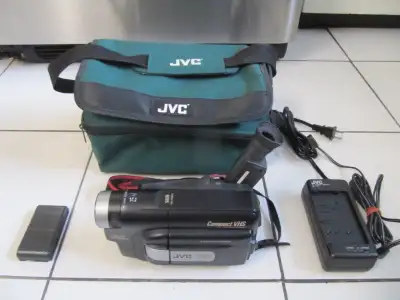 Up for sale is a JVC Model GR-AXM210U VHSC Compact VHS camcorder most likely made in the late 1990s...