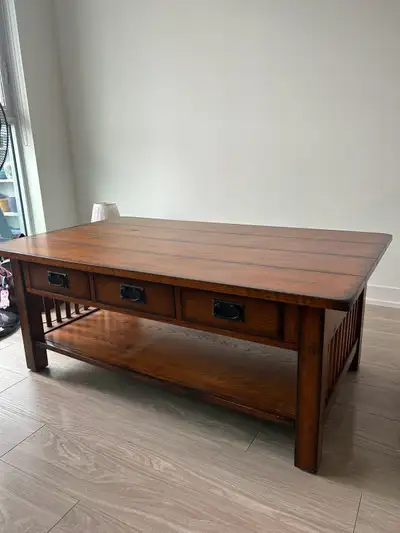 solid wood coffee table with lower shelf and three drawers, View more