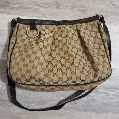 There's a tiny stain inside of the purse shown in the picture 5 other than that it's in great condit...