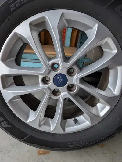 I have four all season tire's on FORD alloy rims great condition just over 5mm of tred lots of life...