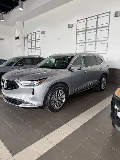 Experience premium driving with this sophisticated silver Acura MDX, a well-maintained SUV that blen...