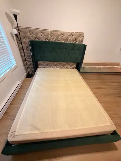 A green velvet queen bed frame, box spring, and queen mattress for $320. It has been well maintained...