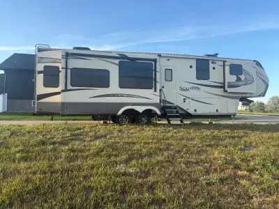 5th wheel trailer with 4 slides and ample storage Bedroom with king size bed TV in bedroom and livin...