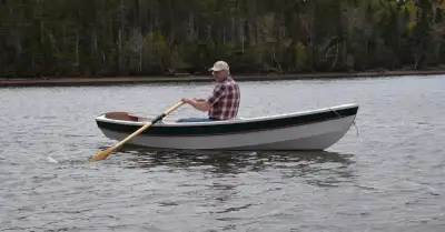 New shellback dinghy/tender designed by Joel White. 11' 2" long with a 53" beam. Weight is a little...
