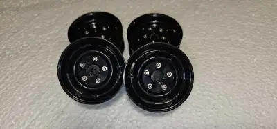 NEW never used. 12mm hex rims -plastic, not beadlocks. Compatible with Axial SCX10, SCX10 IlI, Tamiy...