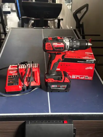 Milwaukee hammer drill, XC 4.0 battery and dual charger all new, View more