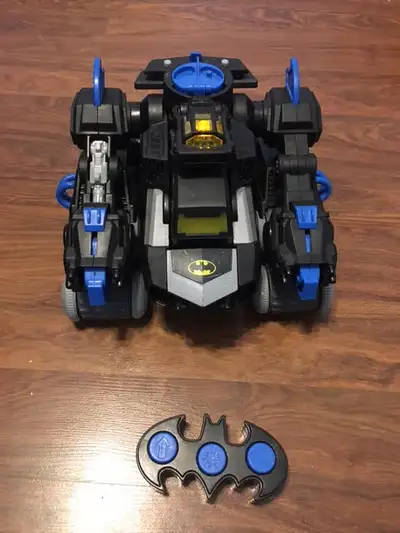 i am selling a used rc batman transforming toy robot with remote. moves around, lights up and makes...