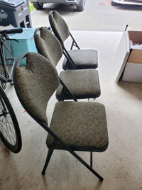 Three folding chairs