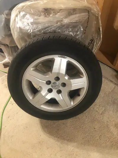 Pirelli P215/60R17 Tires and rims from Dodge Caliber. Good condition Minimal wear.