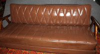 Leather couch/futon with storage space