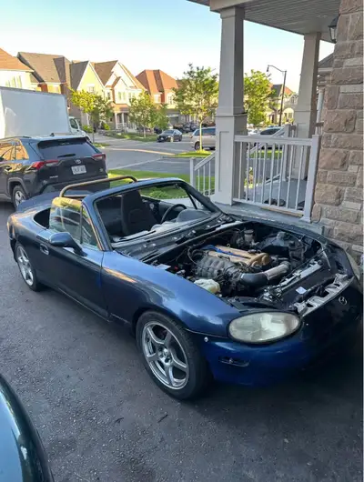 99 Miata was in front end hit . I threw on some suspension components and body parts to get it rolli...