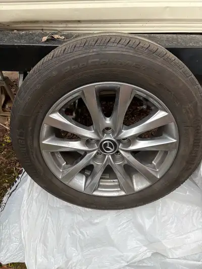 4 Mazda aluminum  rims and tires with tpms, View more