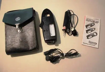 GE Clamp on Amp meter with volt and ohm options. Has manual. Older analog but still in great shape....