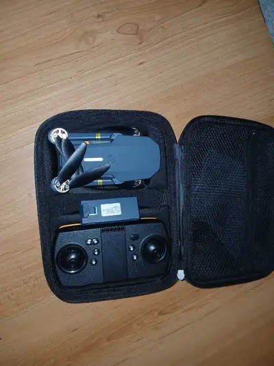 Capture stunning aerial views with this compact drone! This drone is in used condition, but it still...