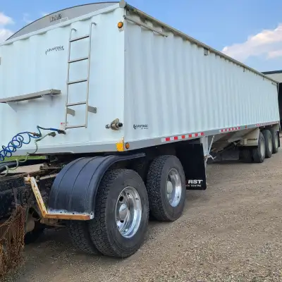 Tridem, tri-hopper grain trailer. One owner. Tarp in good condition. $47,000 O.B.O.