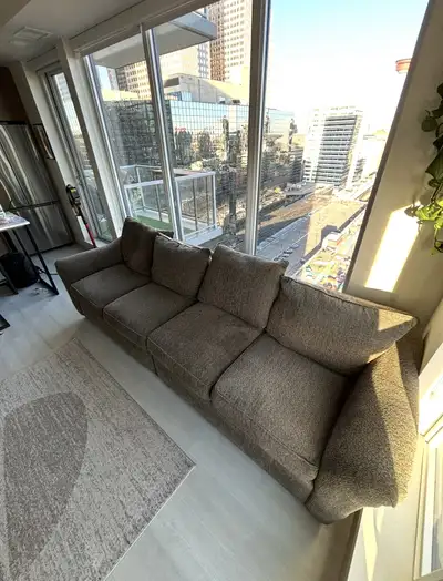 Couch is 38" W x 106" L but separates into 2 pieces that are each 38" W x 53" L. It is basically new...