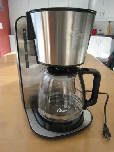 Oster coffee maker. Drip coffee machine makes up to 12 cups. Can delay the start of brewing . It wil...