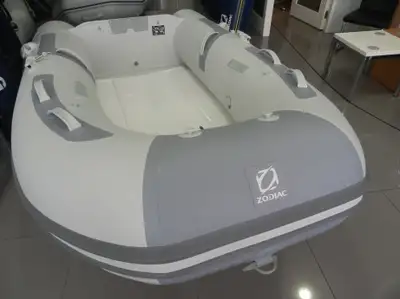 like new Genuine Zodiac with rigid fiber glass v hull floor comes with low hours Yamaha 9.9 short sh...