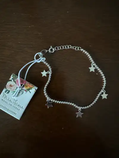Really cute brand new stirling silver bracelet. Fits a small wrist. Cute gift!