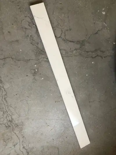 4 feet wide and 4 inches tall quarts backsplash for a bathroom vanity that was never used.