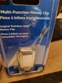 Money Clip, stainless steel 
Multi function with nail file & sci