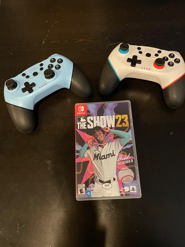 A pair off week old retro Nintendo Switch controllers + 2023 MLB in Nintendo Switch in La Ronge