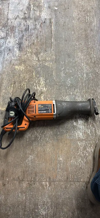 Offering a Ridgid R3001 Reciprocating Saw, ideal for cutting through various materials with ease. Be...