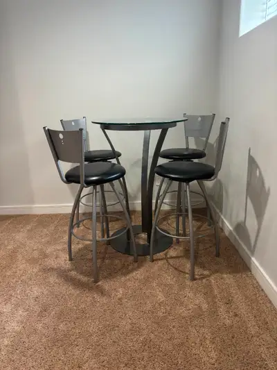 Moving and need to sell asap. Like brand new. Round glass top no scratches, stainless steel type mat...