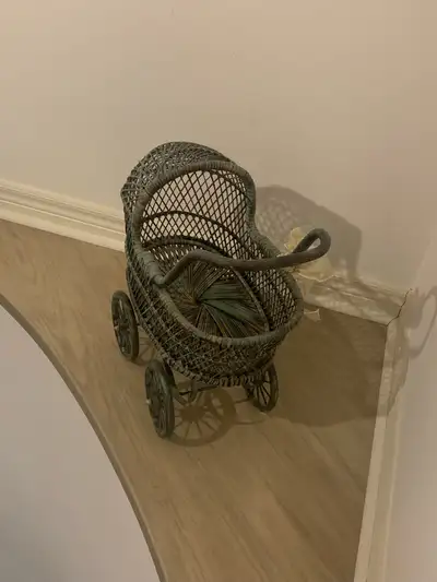 Add a touch of vintage charm to your collection with this quaint, used decorative baby stroller. It'...