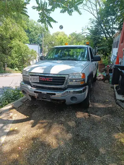 Sierra 2500 HD plow truck. Body is rough, engine starts but lacks power. Looks to be an electrical s...