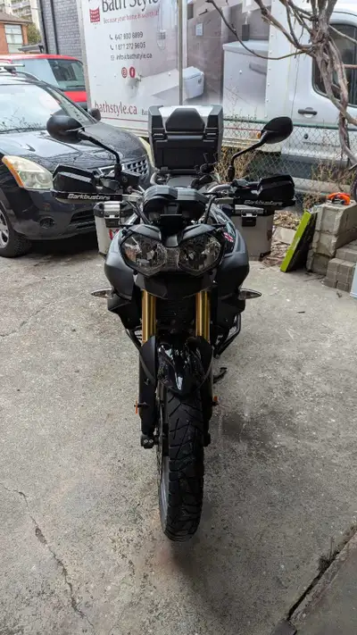 2013 Triumph Tiger 800ABS. Bike has hard Givi side cases, Triumph beer case, Barkbusters grip guards...