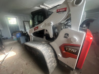 Skid steer operator, grading and earth moving 