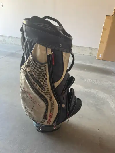 Older Sun Mountain cart bag, well-used but fully functional — perfect for a new golfer who wants a r...