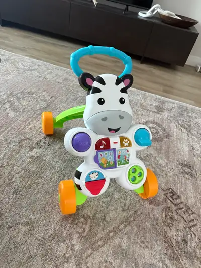 Can be used as walker or can be used as an activity centre with music & lights. In mint condition as...