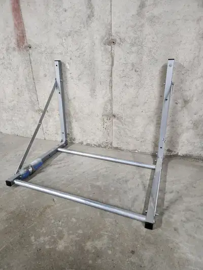 Wall mount, folding tire rack. 48 inches wide. Comes with mounting hardware. Excellent condition.