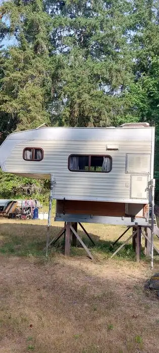 Renovated truck camper in good condition. Working fridge, 3 burner stove, sink with electric water p...