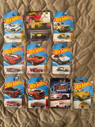 New Hot Wheels Mazda/Datsun set. (Includes one RX-3 premium) Also included is a Transformers bumbleb...