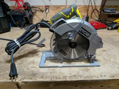 RYOBI 7 1/4-inch 15 amp Corded Circular Saw with Laser Model # CSB144LZK in flawless used condition....