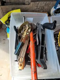 Bin of assorted wrenches
