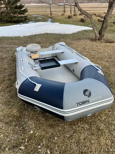 Selling this highly durable inflatable boat and motor in excellent condition rated for 5 people. Flo...