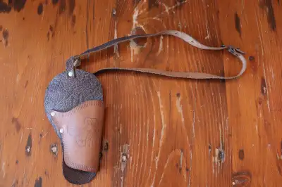 Hi. I have a vintage holster for sale. The single holster and belt shows light wear and marks. There...