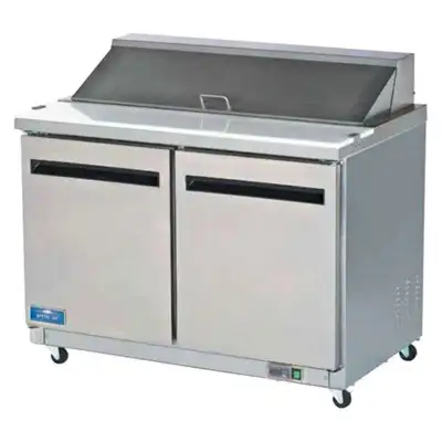 You are viewing a brand new Open Box 2 Door Solid SS Mega Top Sandwich Salad Prep Table Cooler. This...