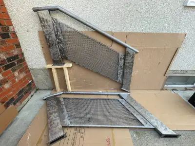 These decoratively brushed stainless steel stair railings were designed for a short stair applicatio...