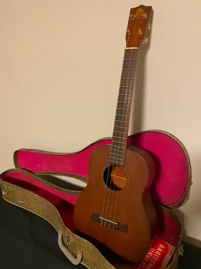 1940-50s Favilla baritone ukulele in collector’s grade condition. Solid mahogany with a Brazilian ro...