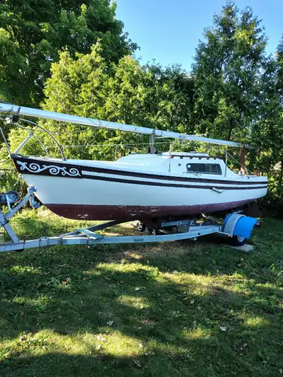 23 foot Olympic sailboat with Load -rite galvanized trailer,5 sails, 2 anchors with chain and length...