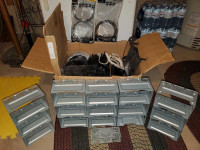 Box of double din cages, speaker grills and trim pieces
