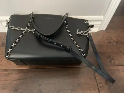 New Danier Purse Never used. Authentic Black leather with Suede lining. Removable shoulder straps Ha...