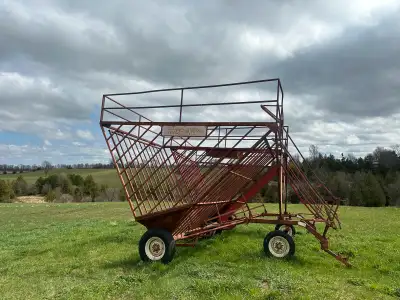 2 Forge King wagons hold around 100 bails, back opens to drop bails out.