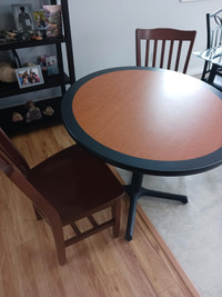 36 inch solid wood table with 2 hardwood chairs.